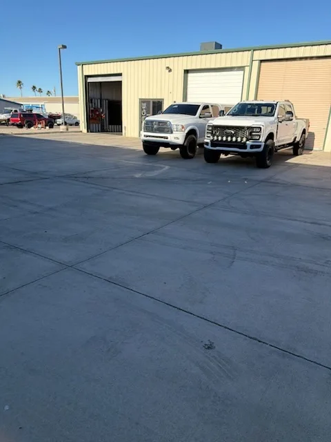 Fleet of work trucks outside Modern Diesel Solutions